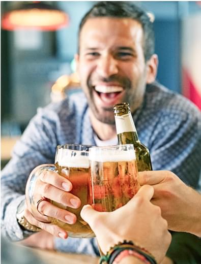 Group of people toasting with beer